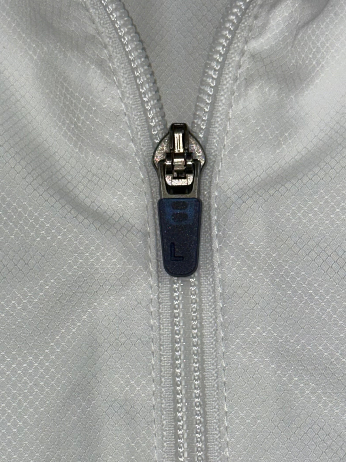 white Lacoste windbreaker {XL}