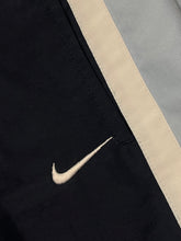 Load image into Gallery viewer, vintage Nike babyblue trackpants {M}
