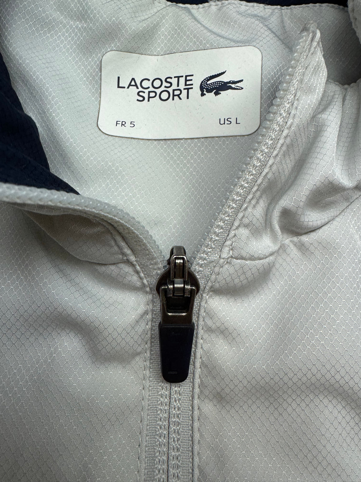 white Lacoste windbreaker {L}