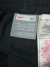 Load image into Gallery viewer, vintage Nike trackpants {M}
