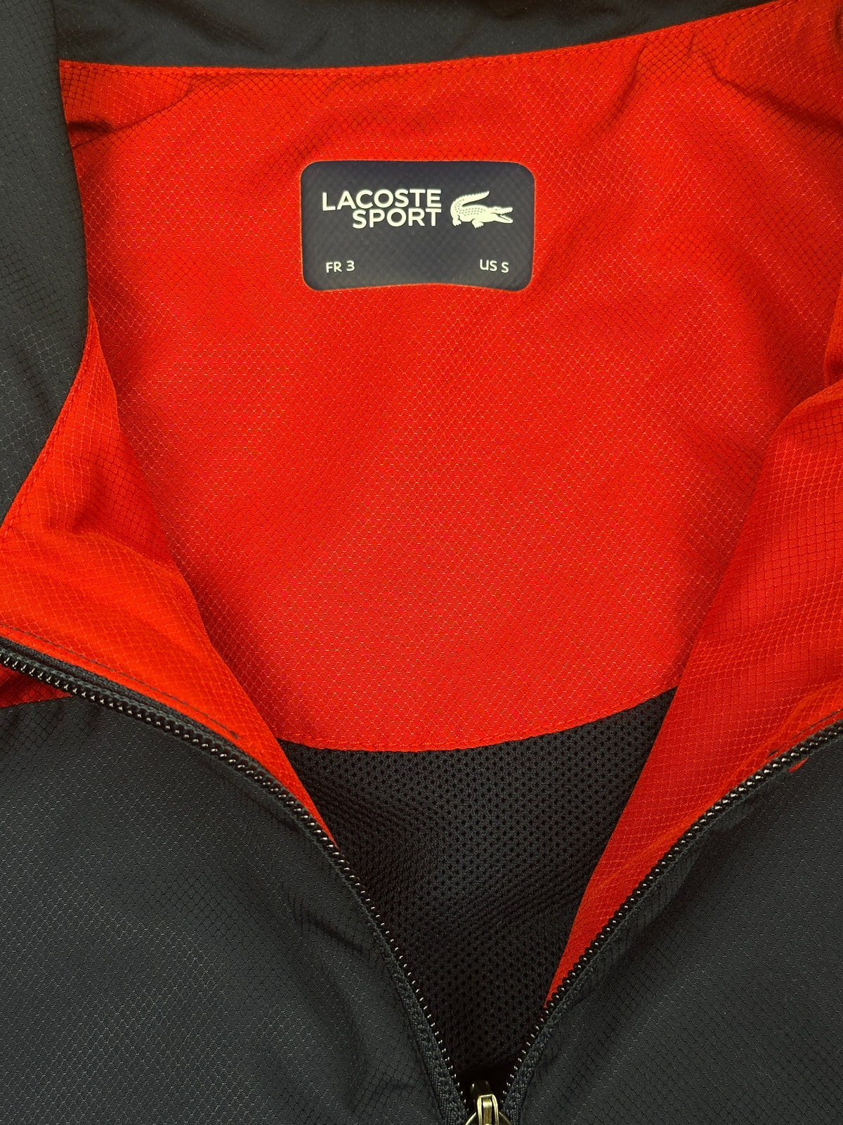 red Lacoste windbreaker {S}