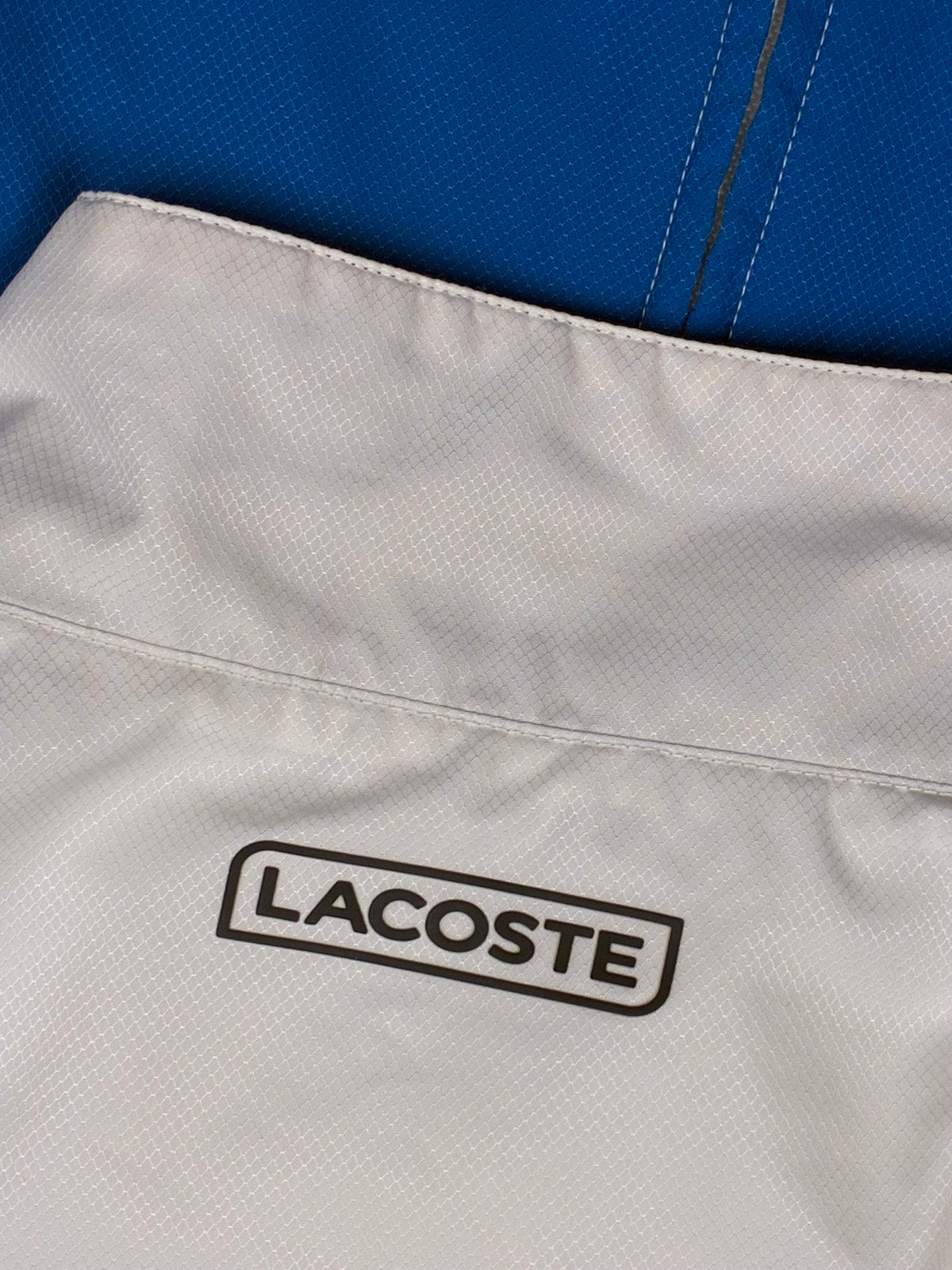 blue Lacoste windbreaker {S}