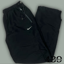 Load image into Gallery viewer, vintage Nike trackpants {L}
