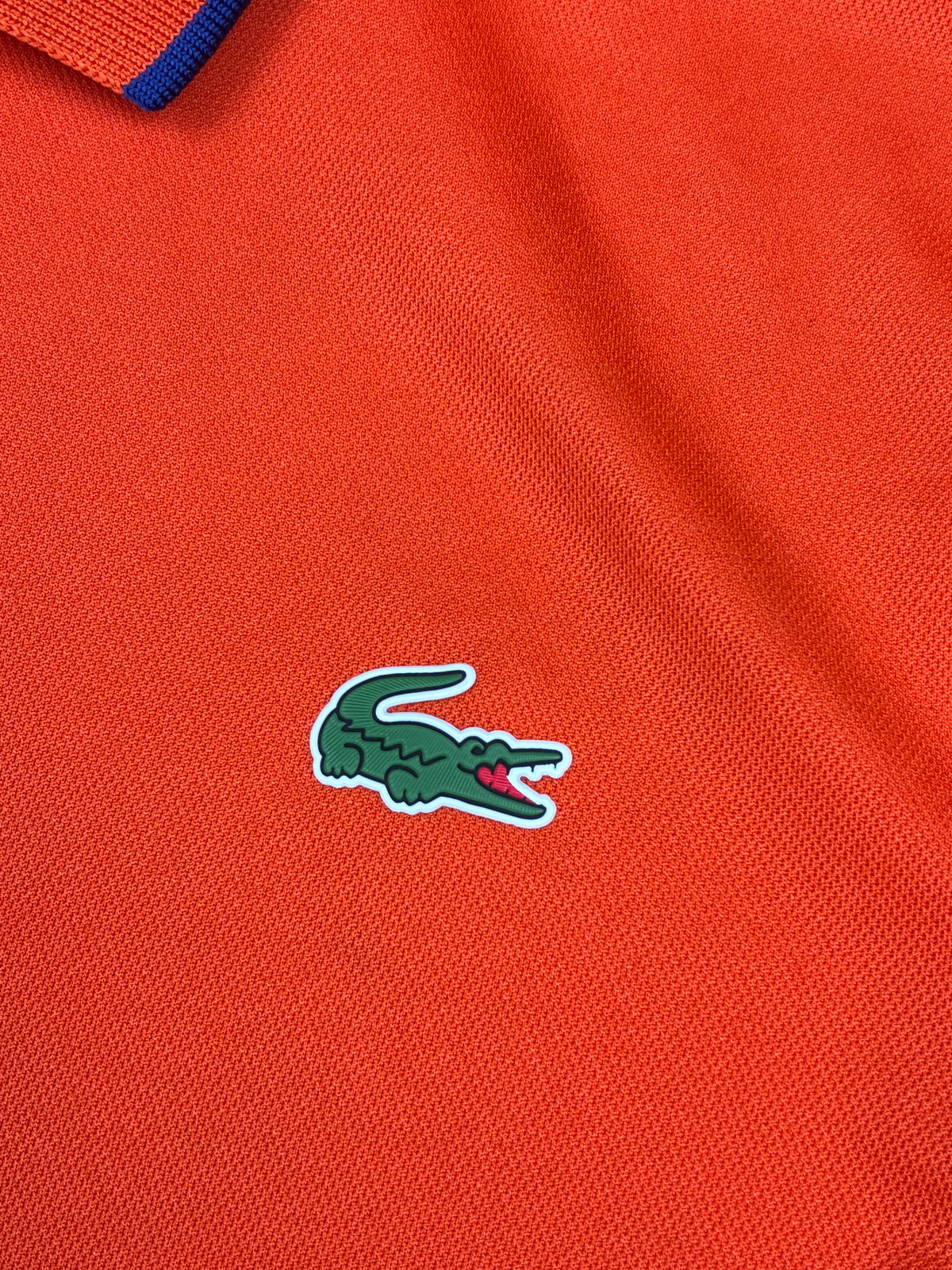 orange Lacoste polo {S}
