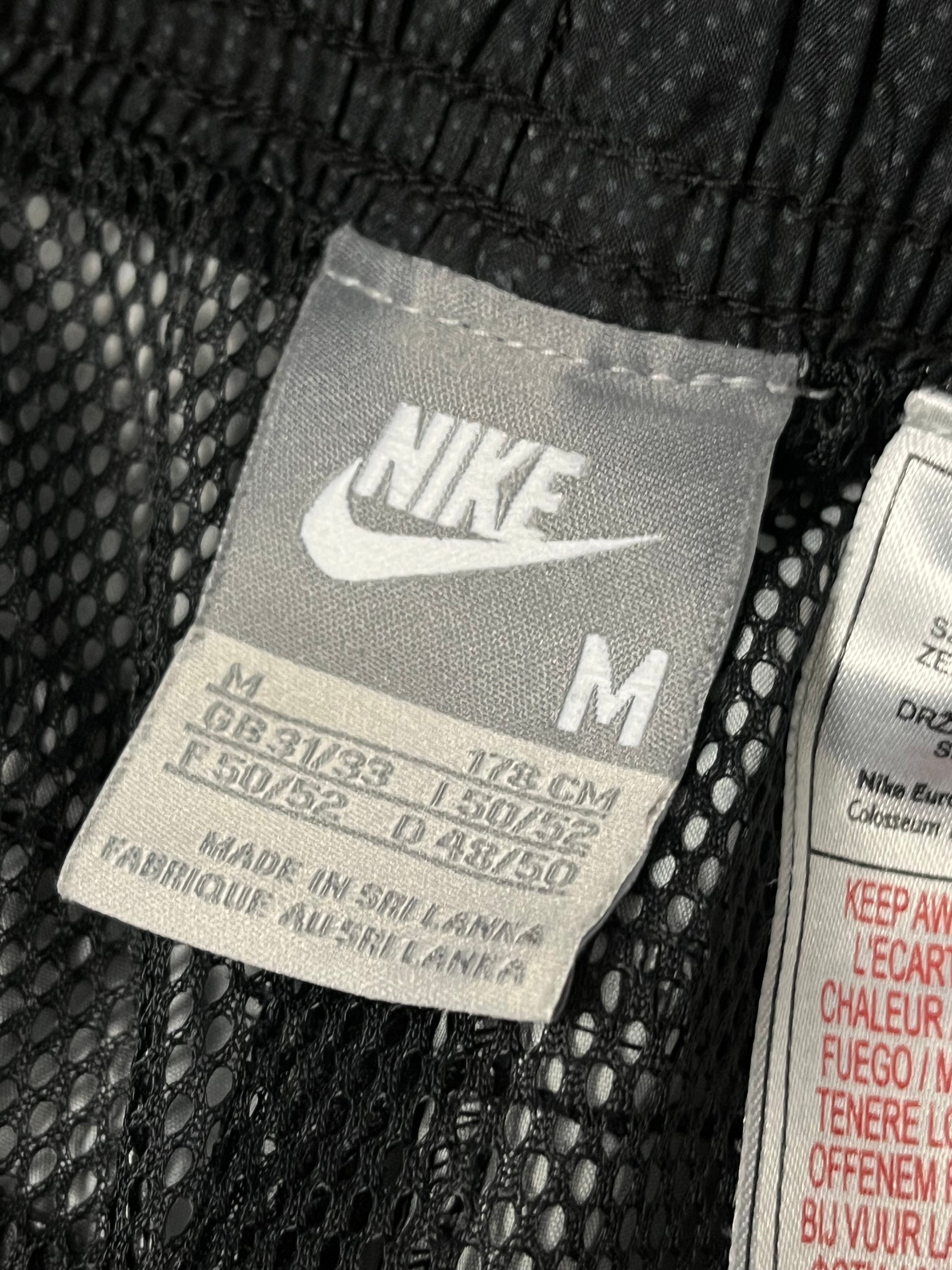 vintage Nike trackpants {M}