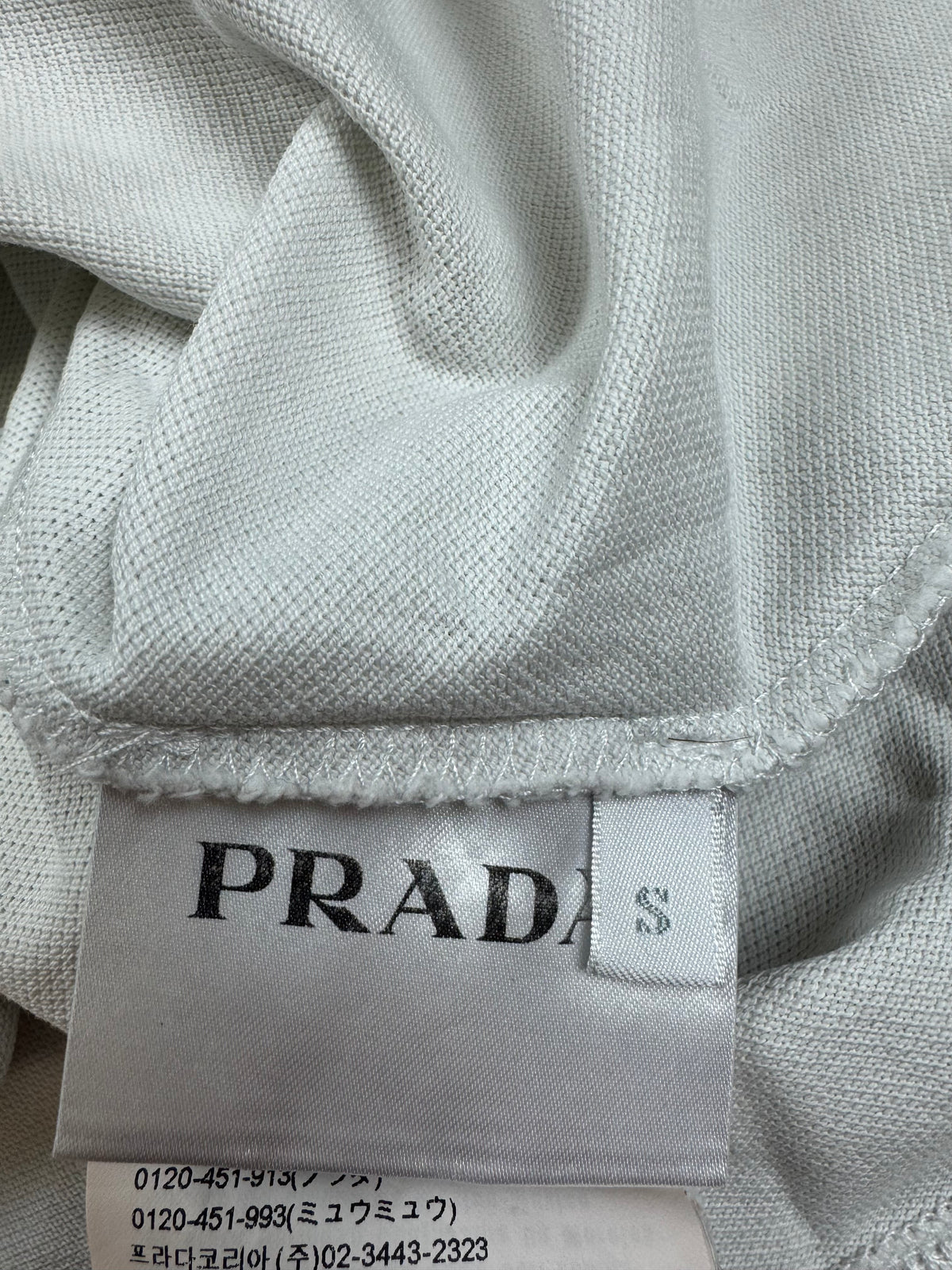 white Prada polo {S}
