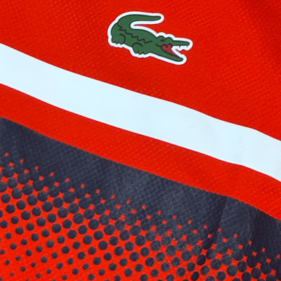 orange Lacoste windbreaker {S}