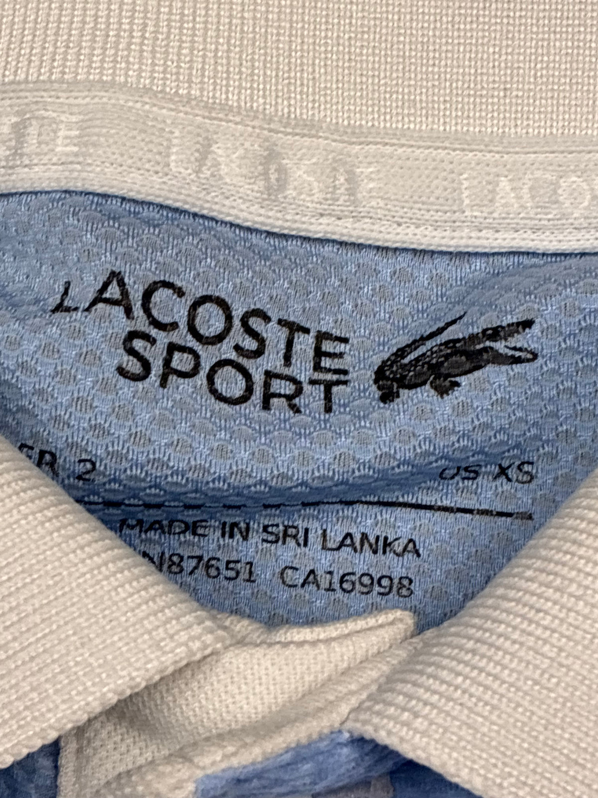 white Lacoste polo {XS}
