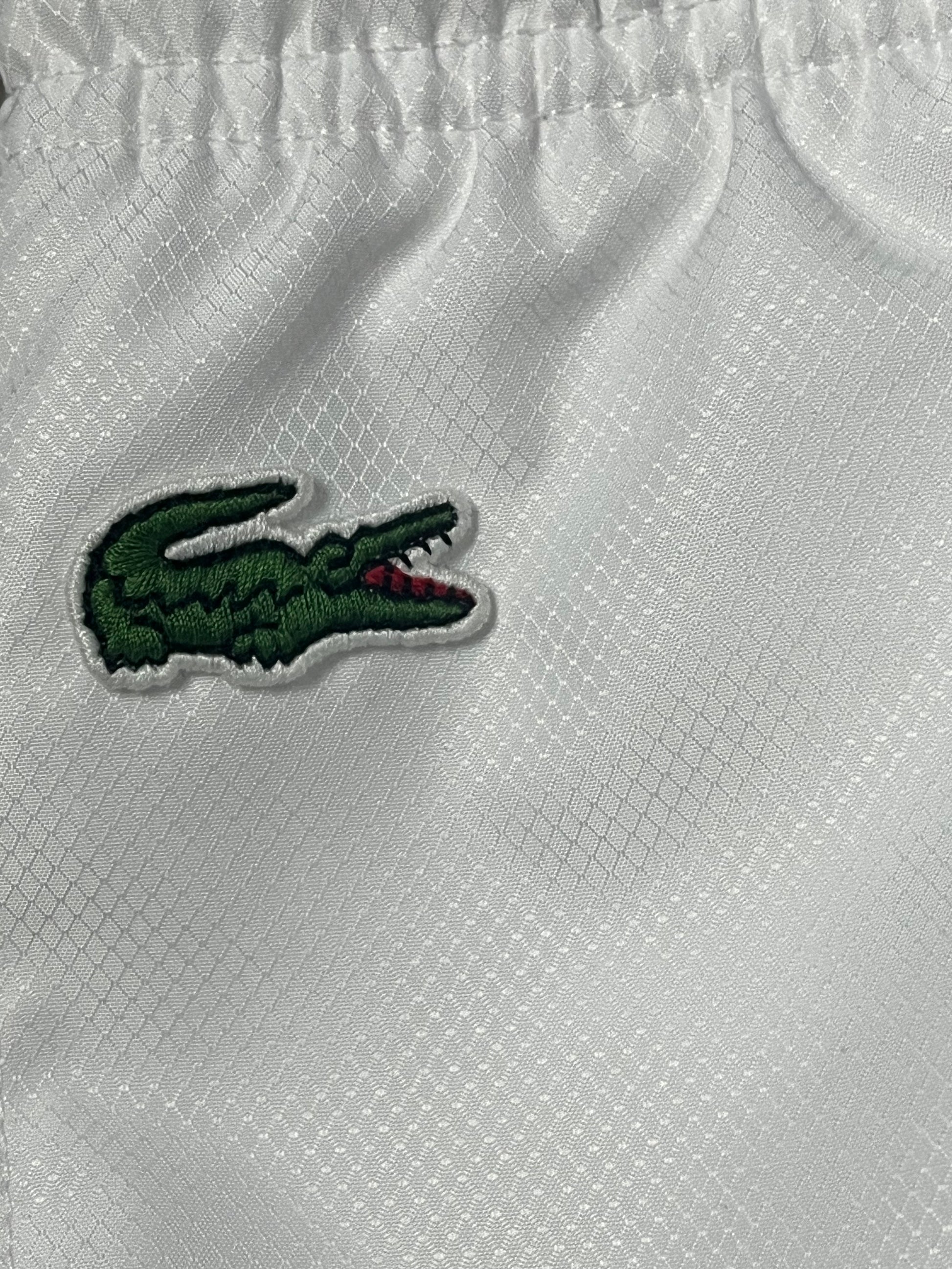 white Lacoste trackpants {M}