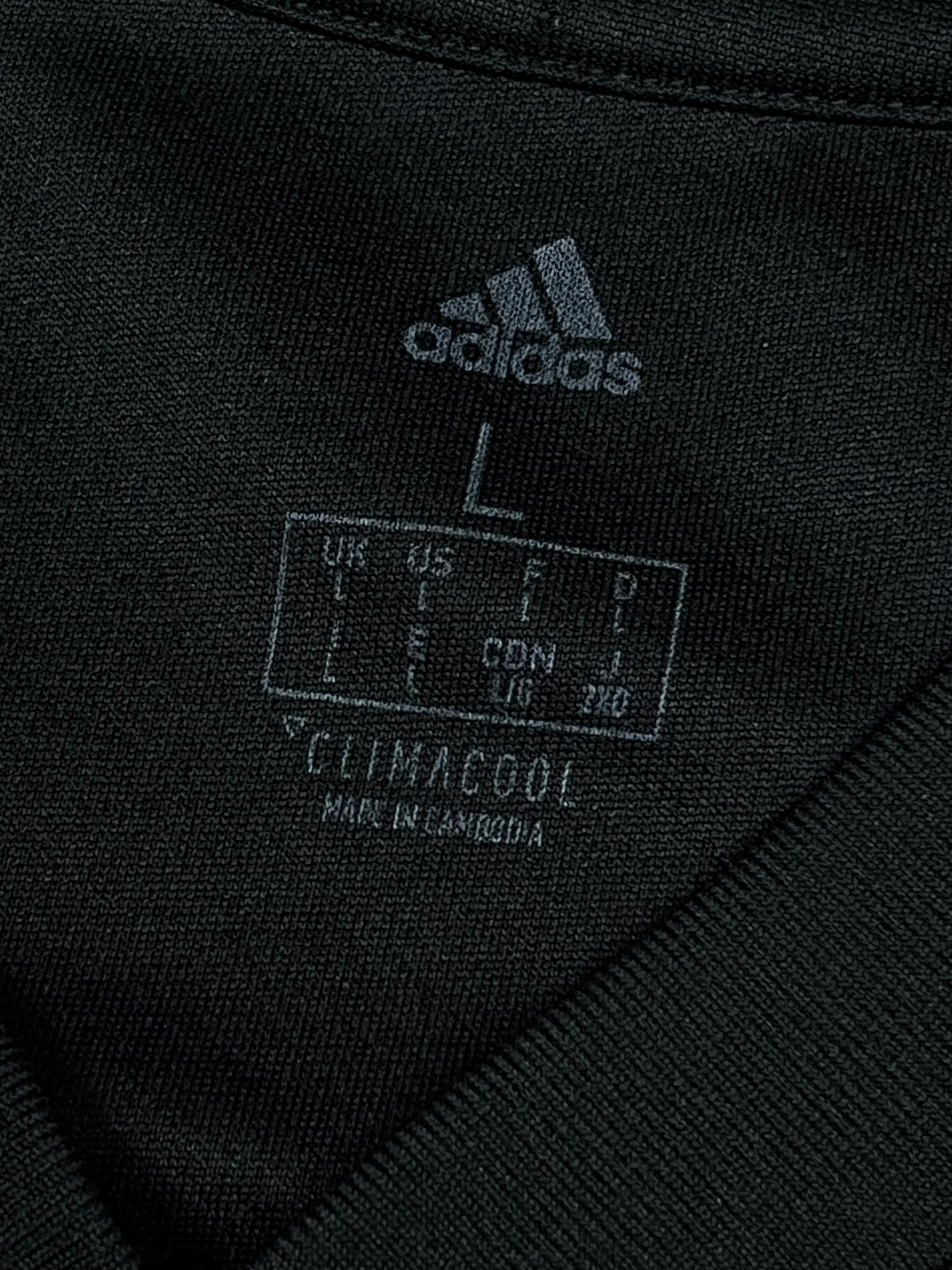 black Adidas Manchester United trainingjersey {L}