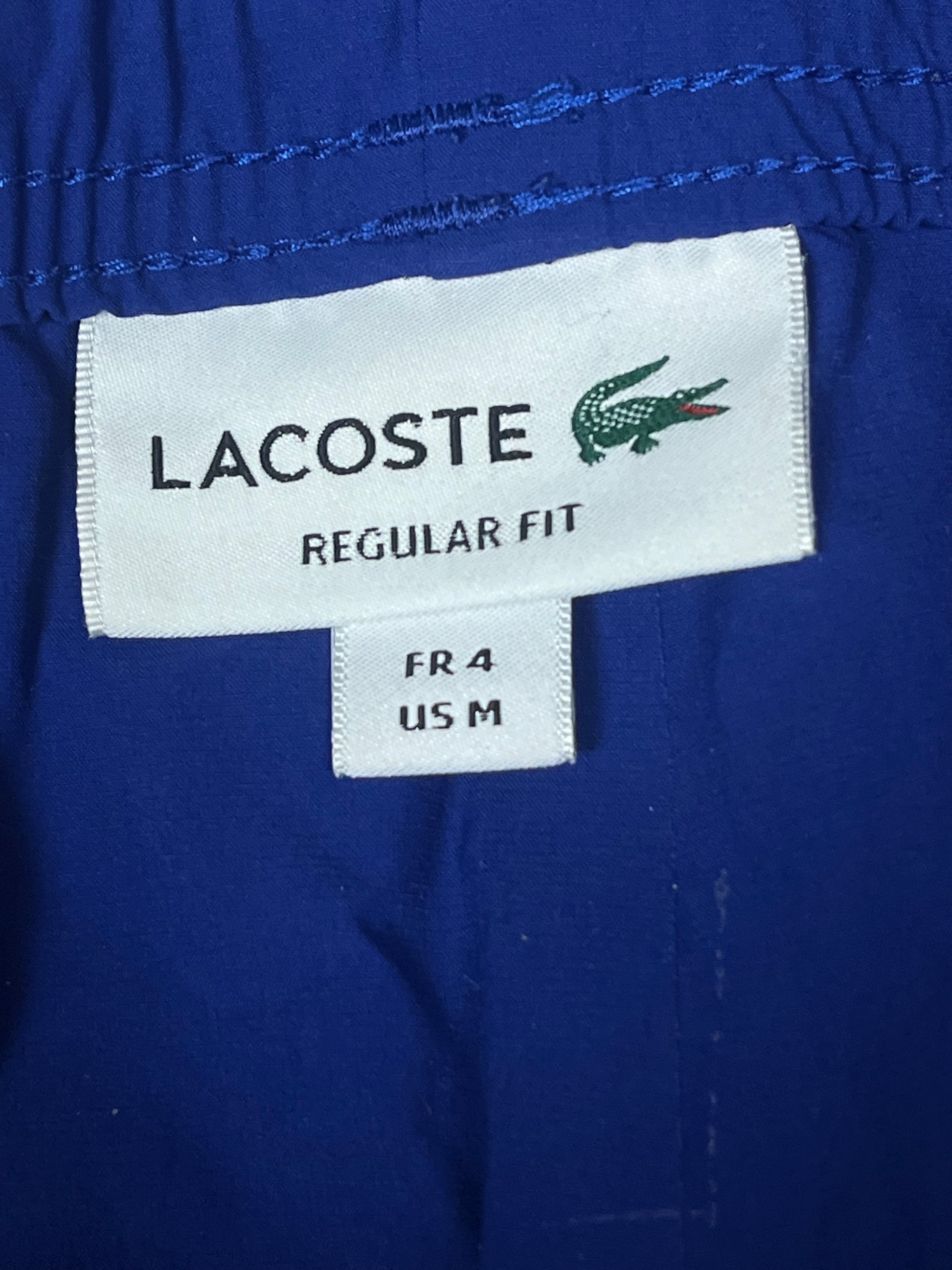 blue Lacoste trackpants {M}