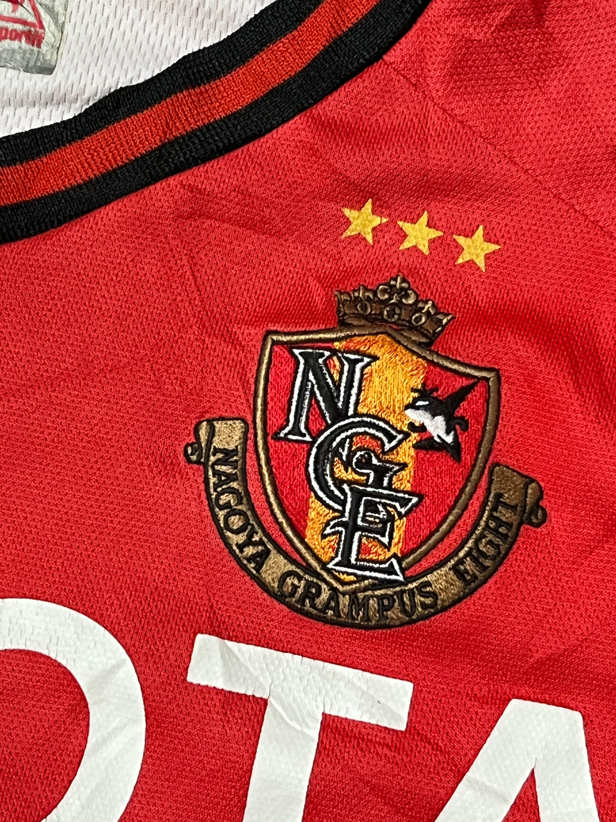 vintage Le Coq Sportif Nagoya Grampus TULIO4 2011-2012 home jersey {S}