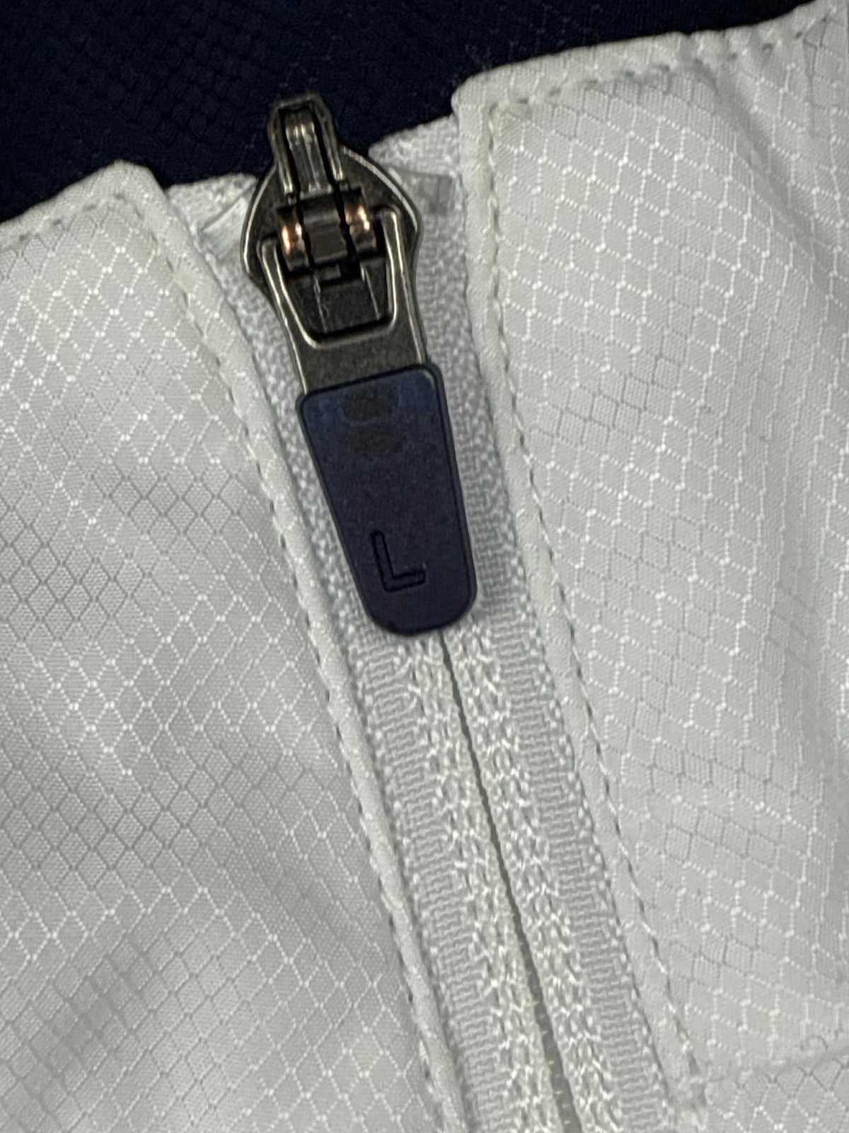 white Lacoste windbreaker {S}