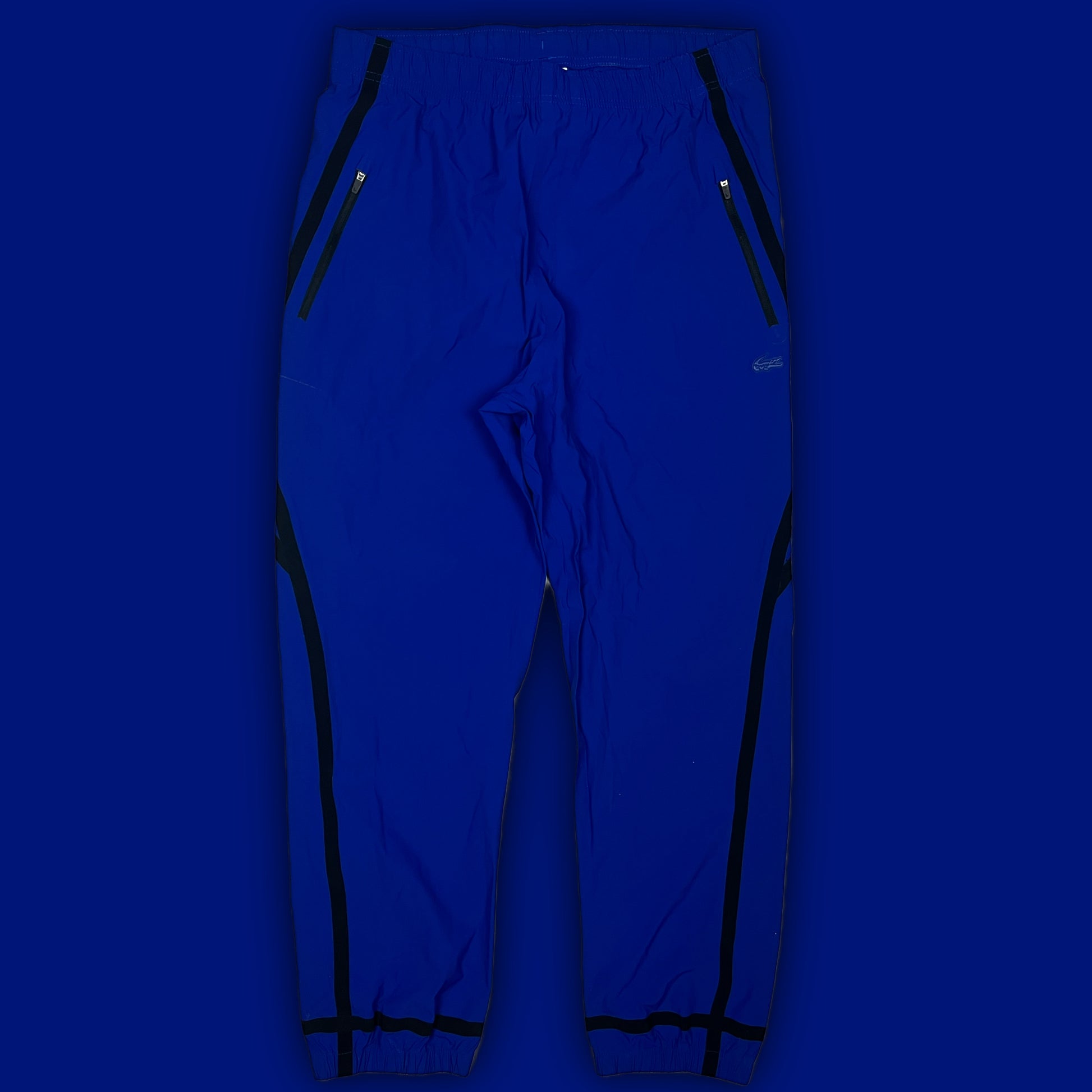 blue Lacoste trackpants {M}