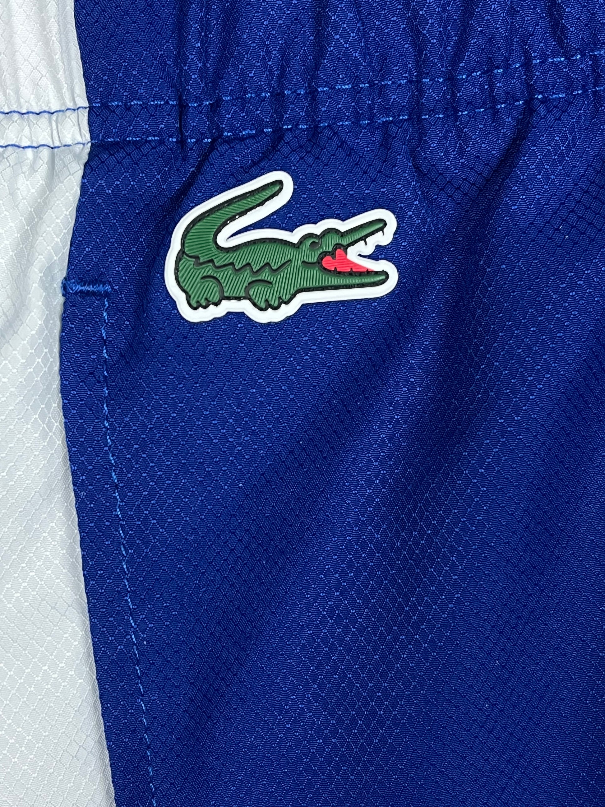 blue Lacoste trackpants {S}