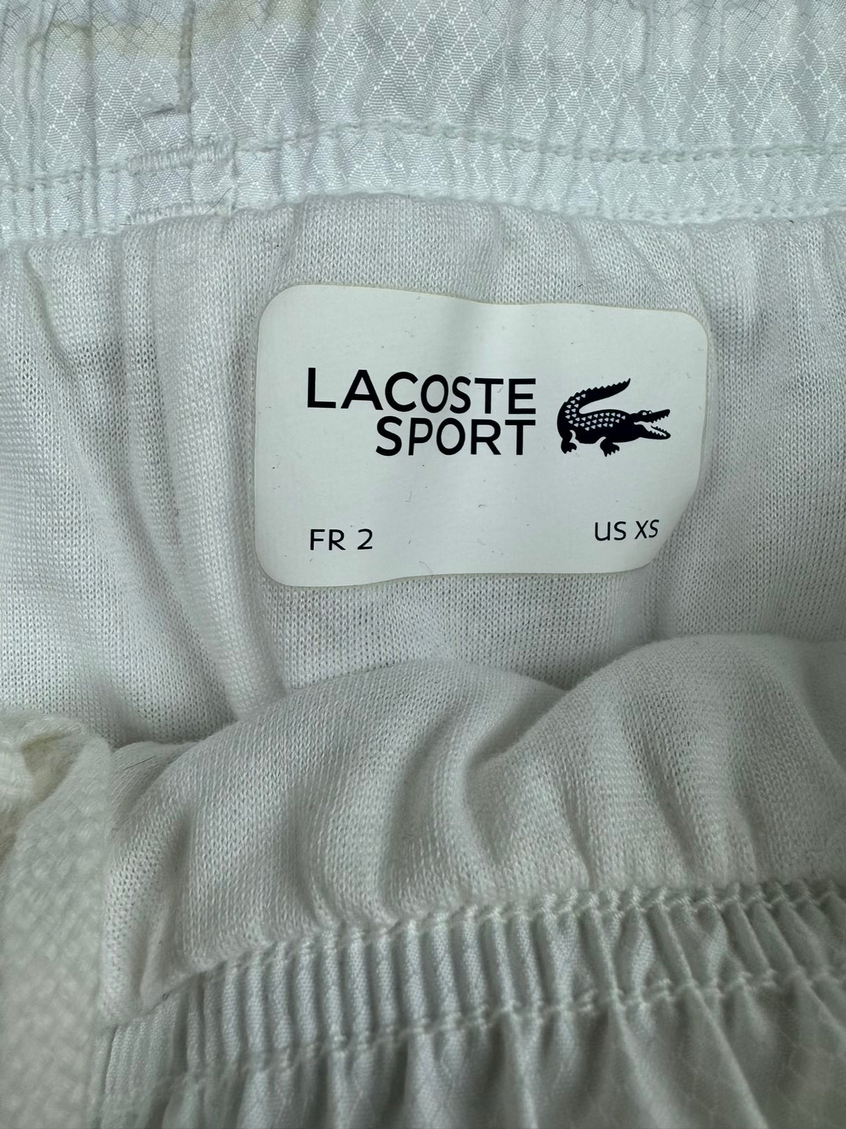 white Lacoste trackpants {XS}