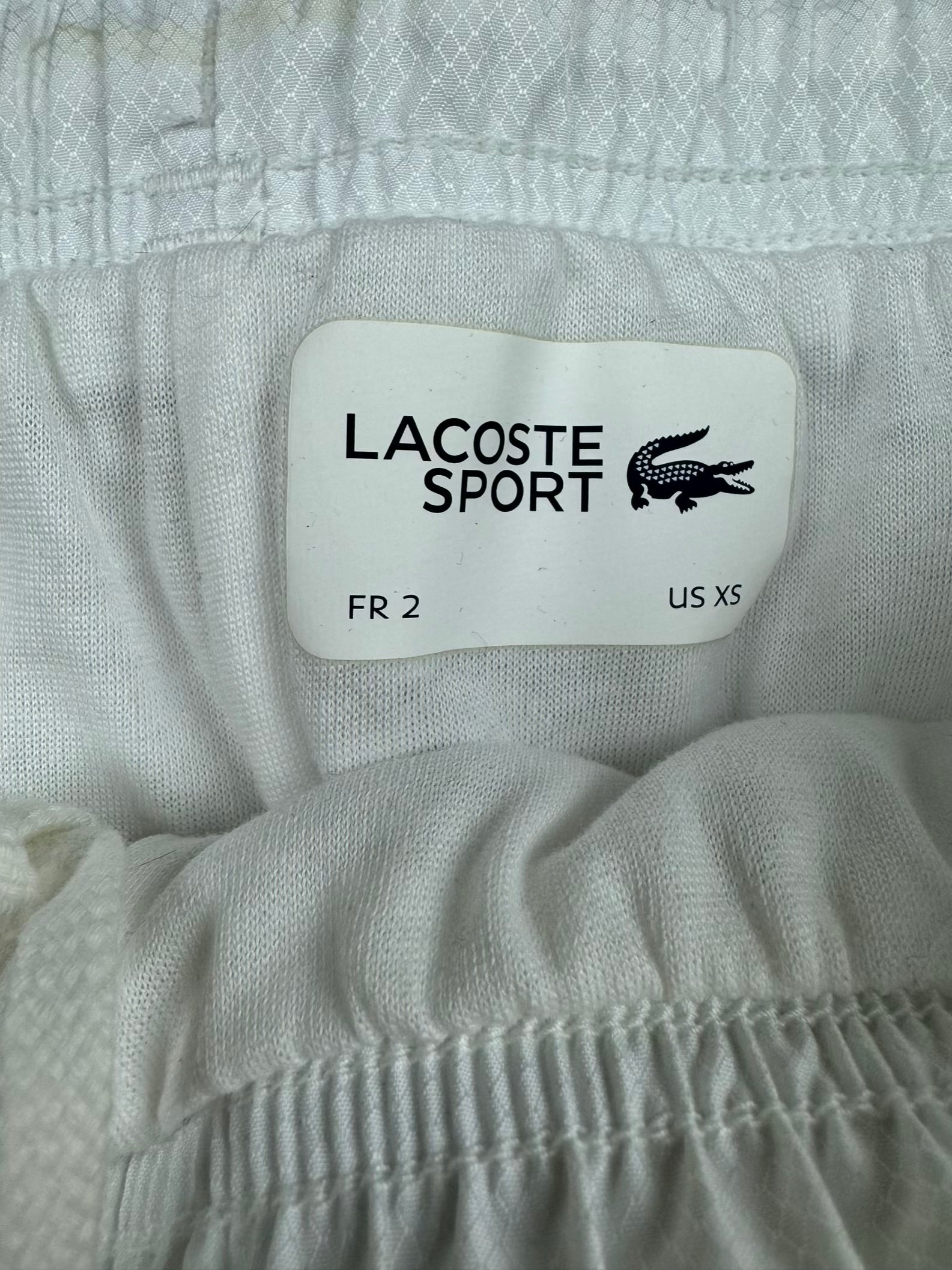 white Lacoste trackpants {XS}