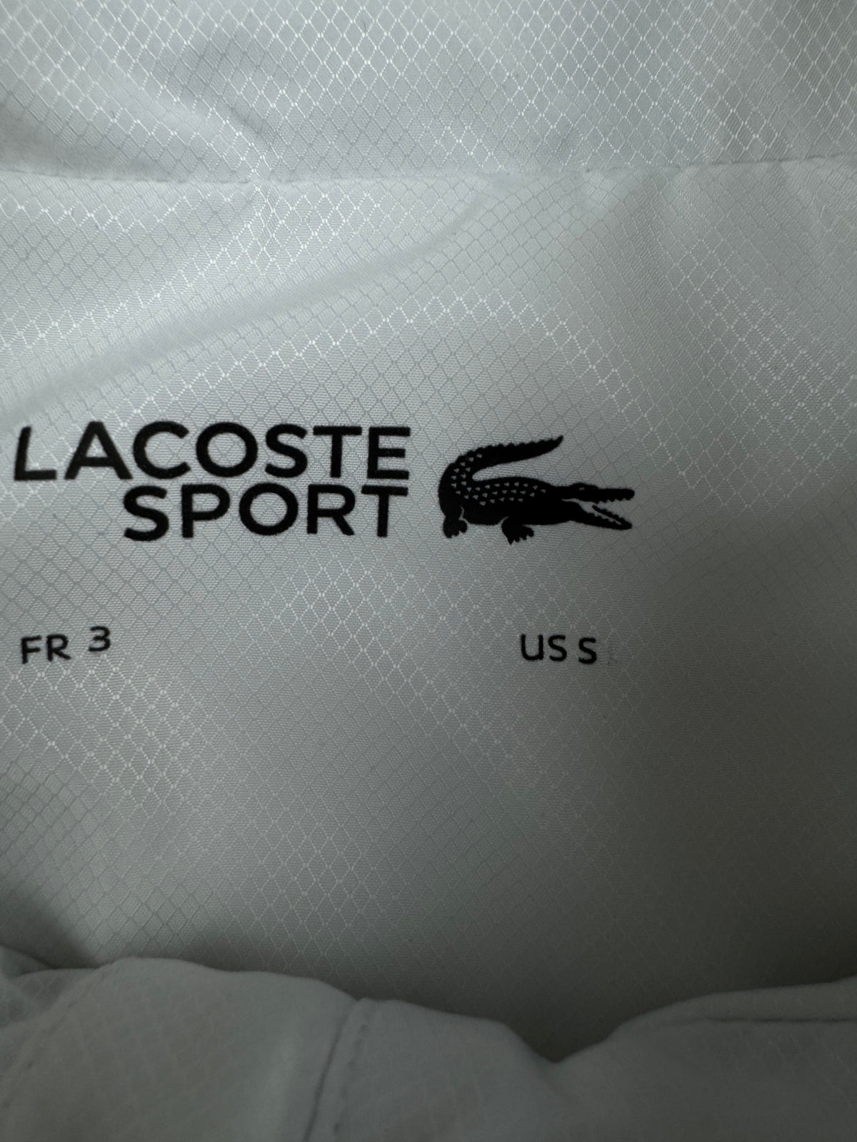 white Lacoste windbreaker {S}