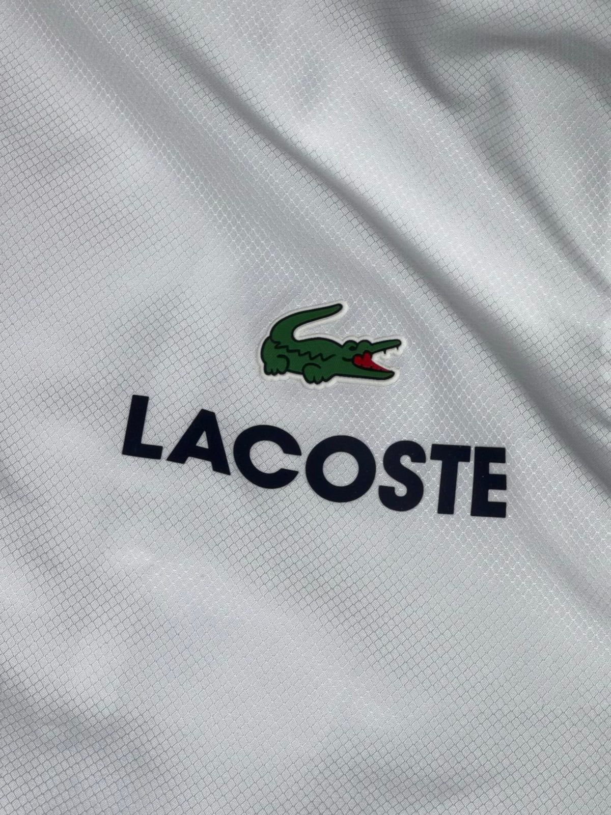 white Lacoste windbreaker {XL}