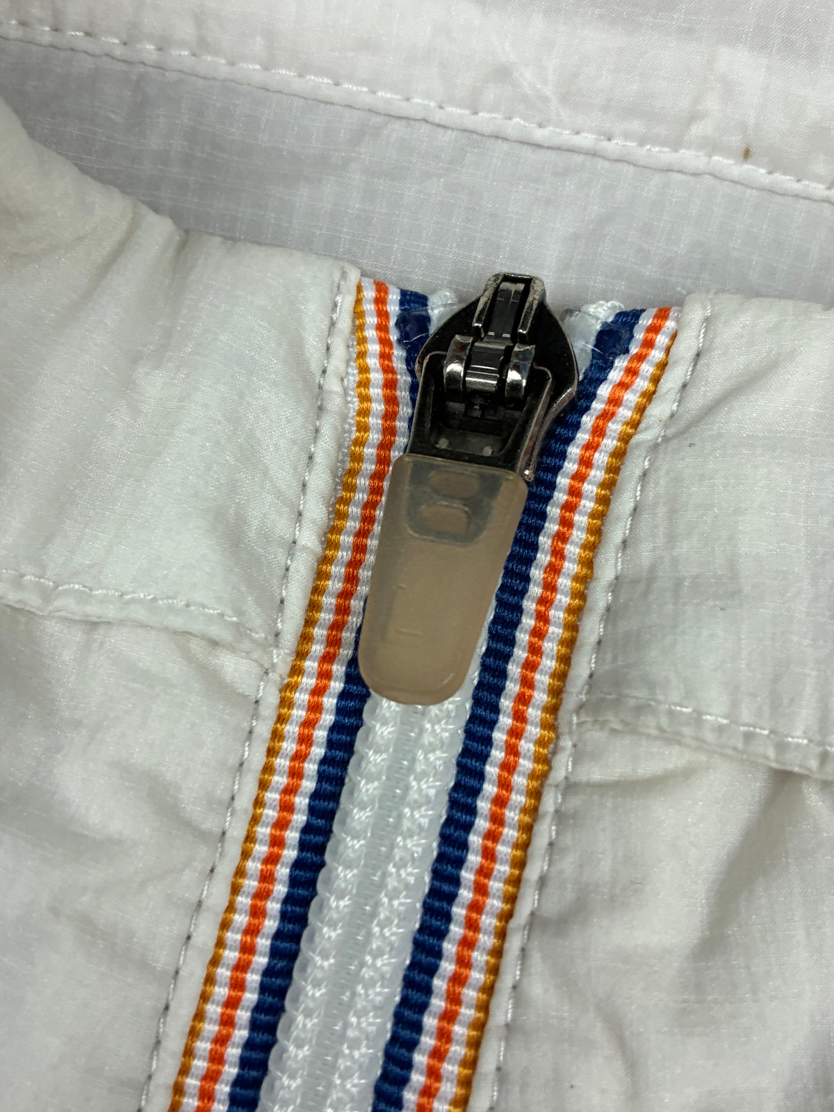 white Lacoste windbreaker {L}