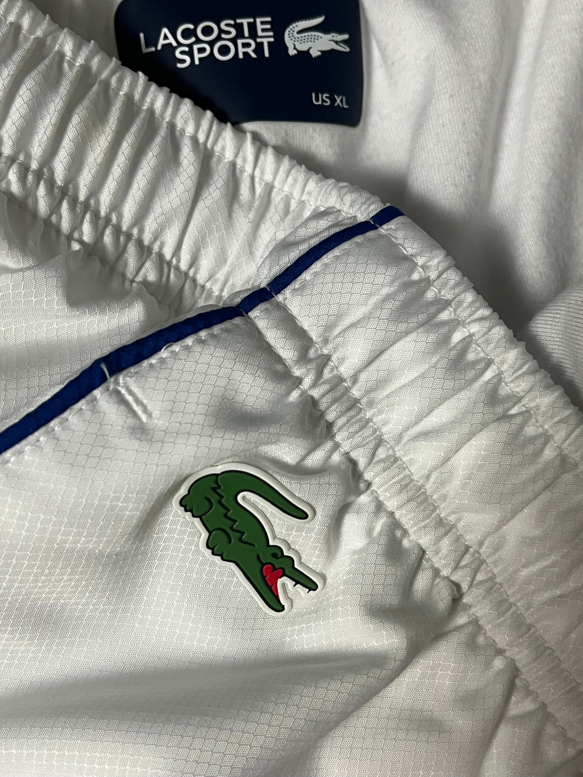 white Lacoste trackpants {XL}