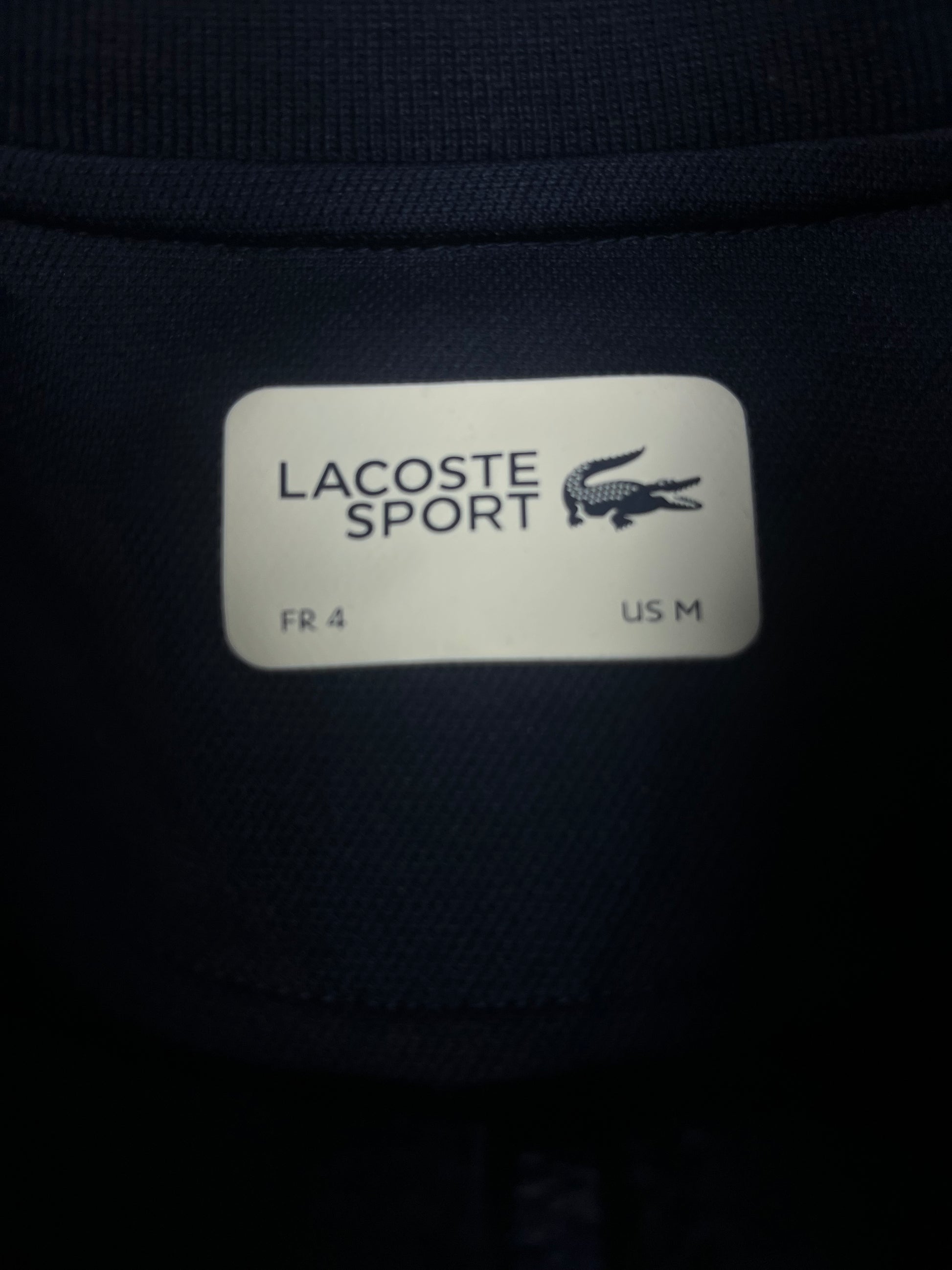 red Lacoste trackjacket {M}