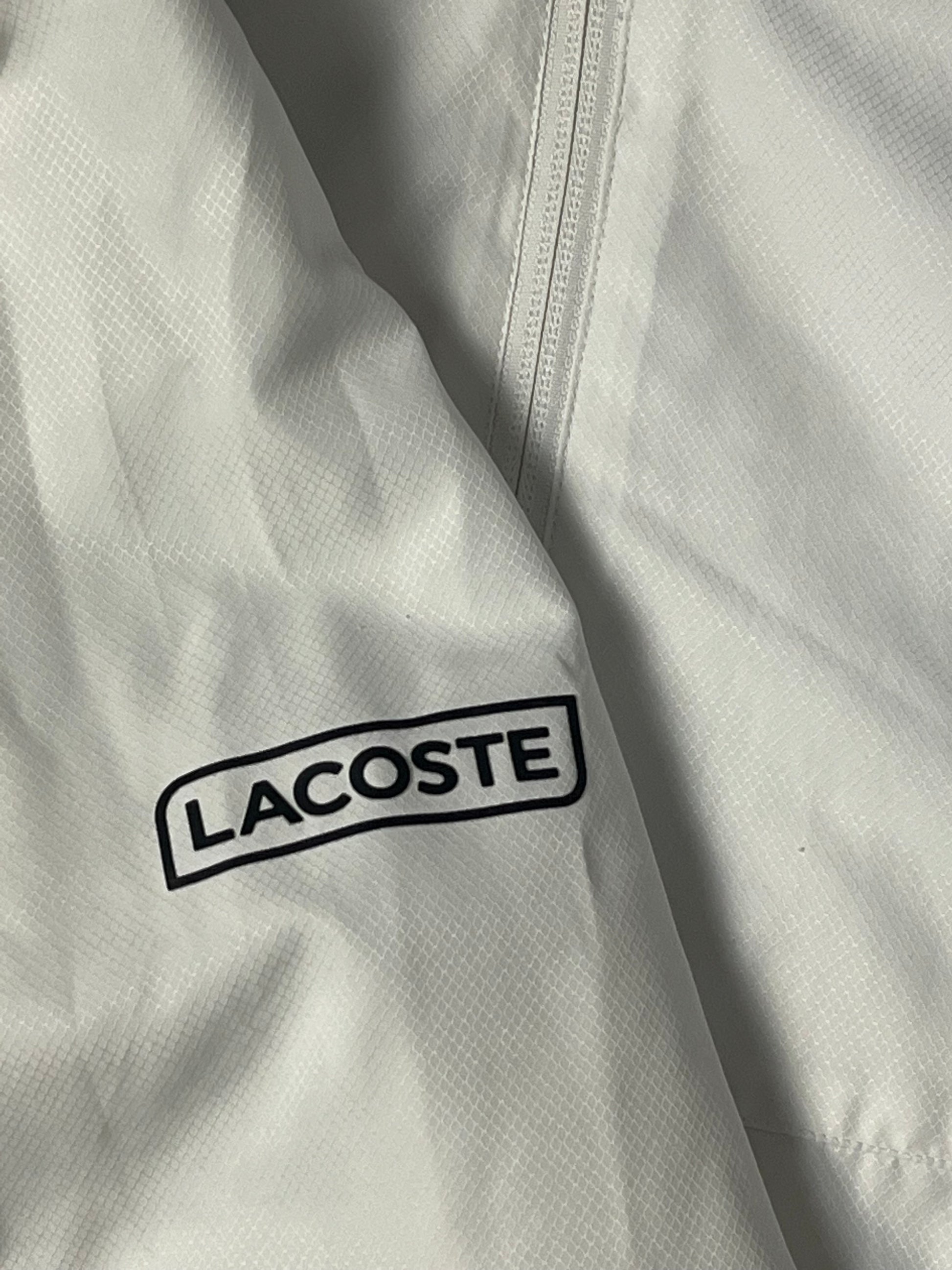 white Lacoste windbreaker {S}