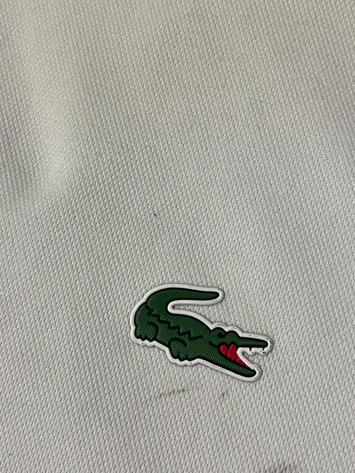 white Lacoste polo {M}