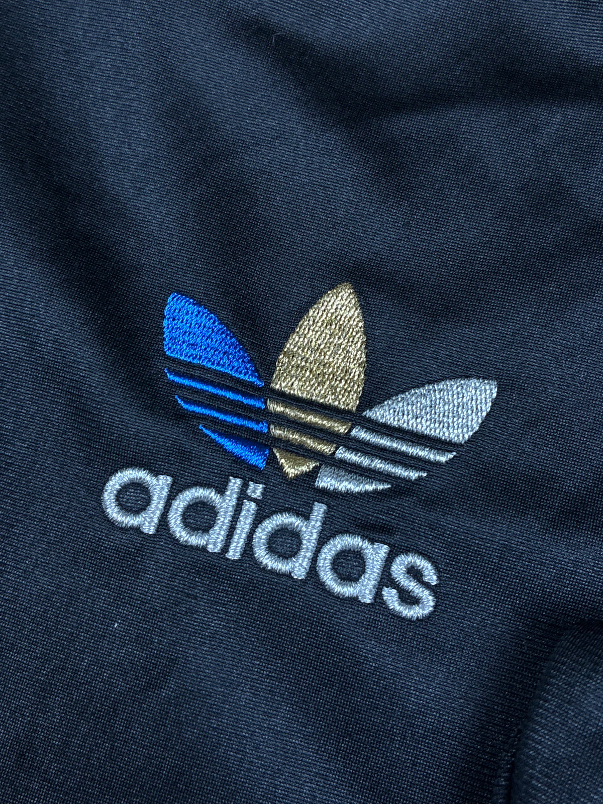 vintage Adidas firebird trackjacket wet look {L}