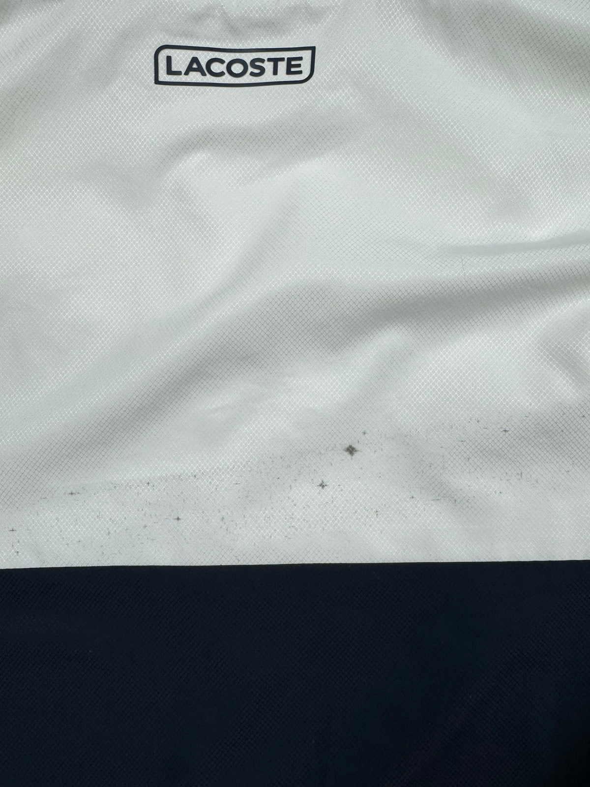 white Lacoste windbreaker {S}
