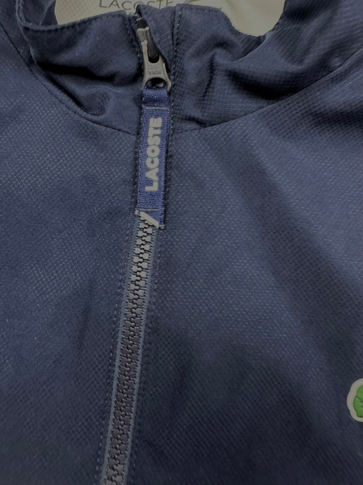 white Lacoste windbreaker {S}
