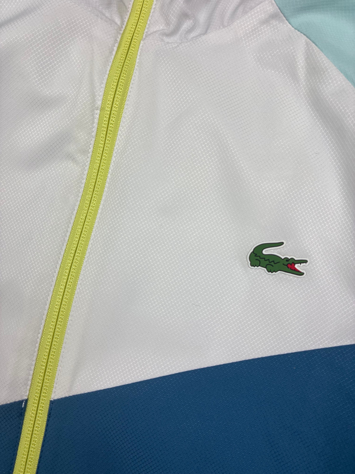 white Lacoste windbreaker {S}