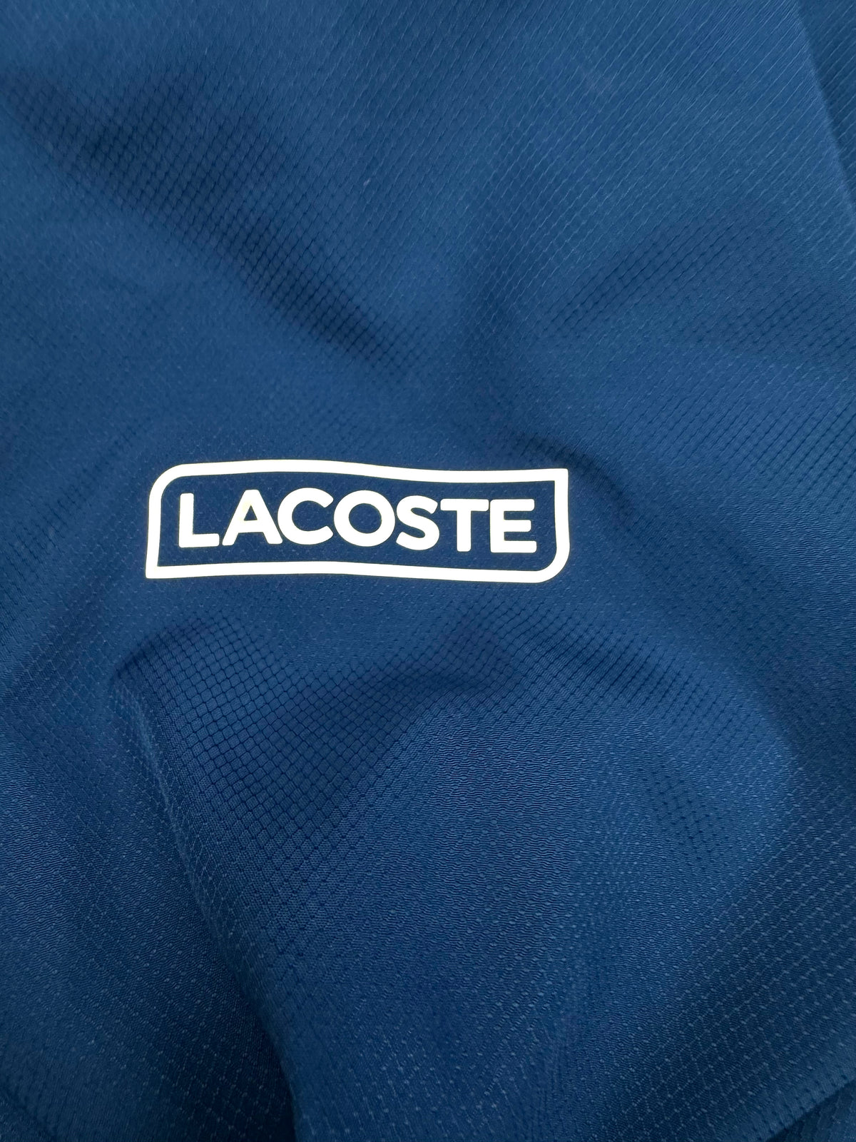 navyblue Lacoste windbreaker {S}