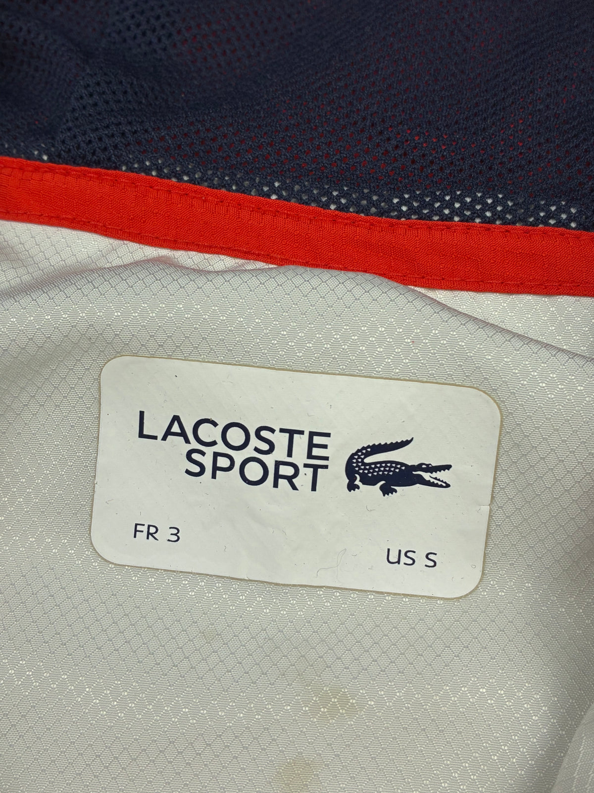 white Lacoste windbreaker {S}