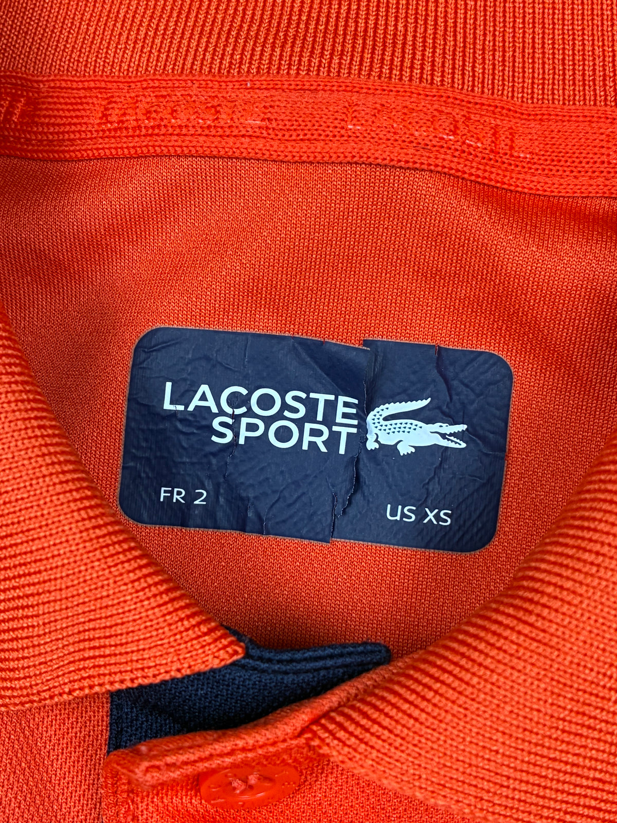 orange Lacoste polo {S}