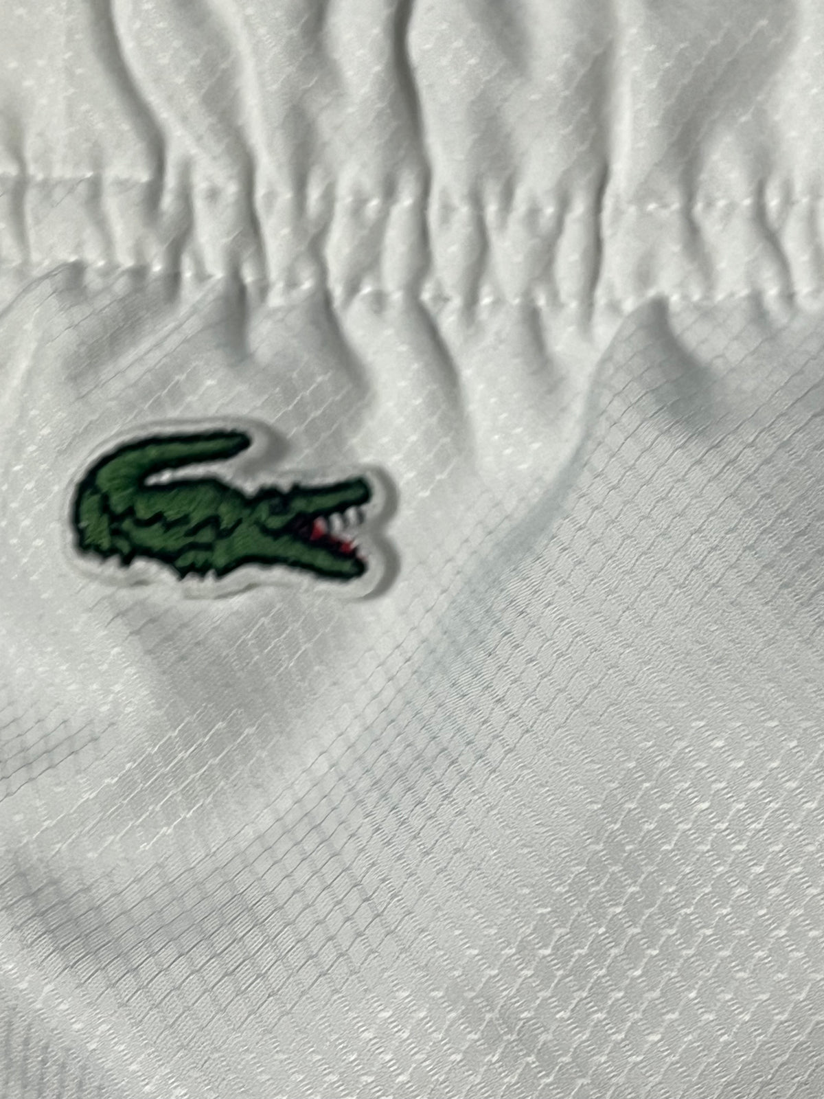 white Lacoste trackpants {S}