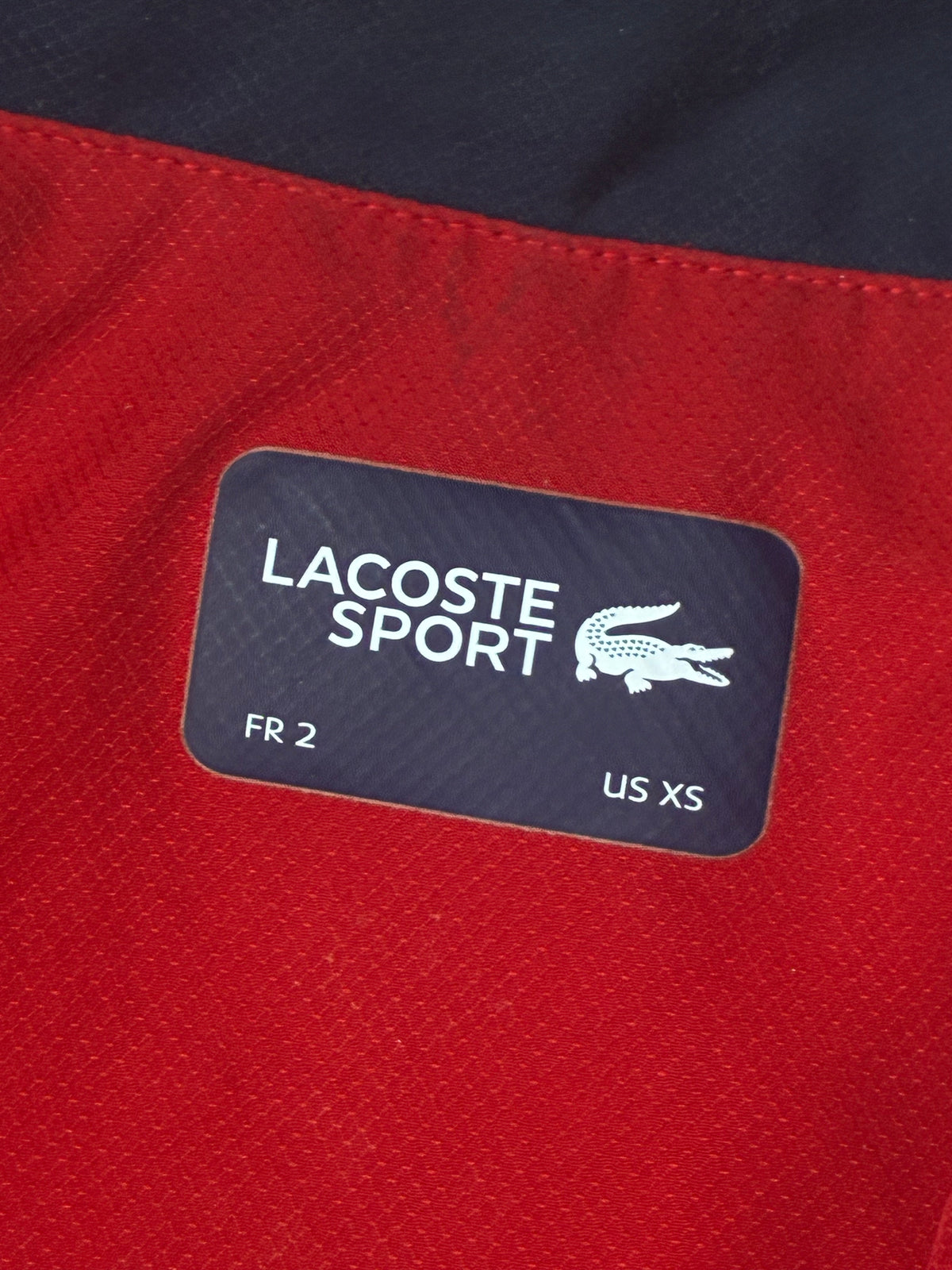 red Lacoste windbreaker {S}