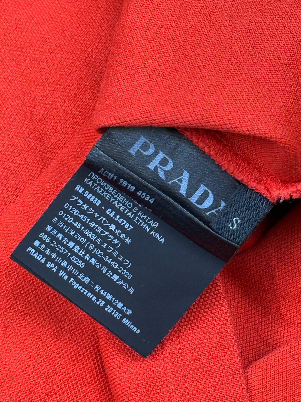 orange Prada polo