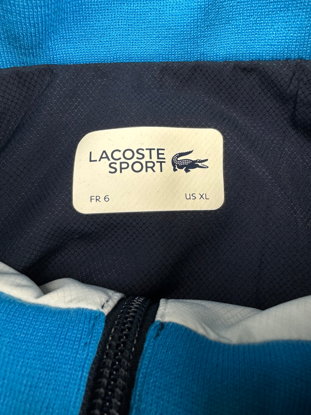 blue Lacoste windbreaker {XL}