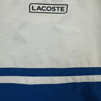 blue Lacoste windbreaker {XS}