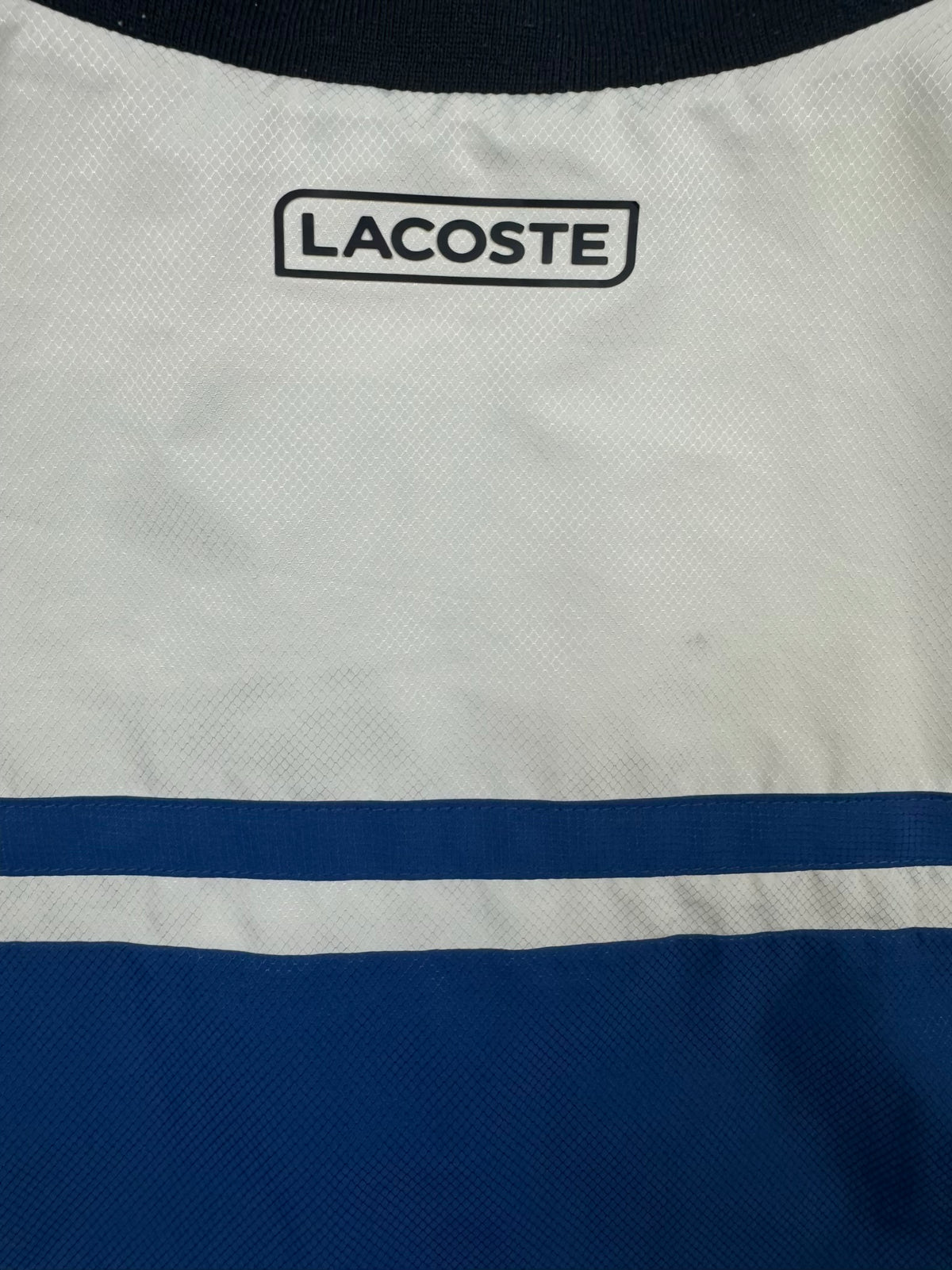 blue Lacoste windbreaker {XS}