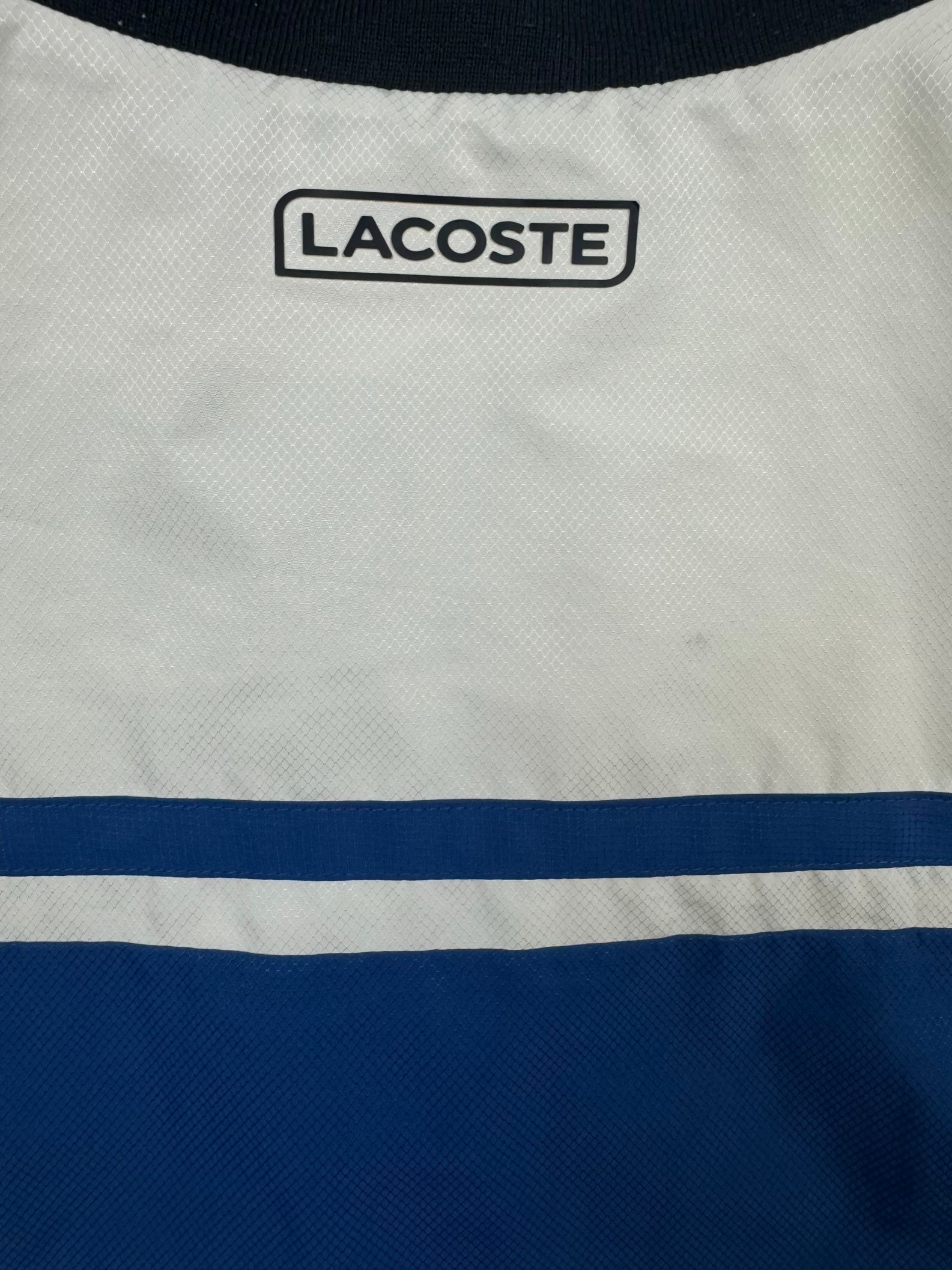 blue Lacoste windbreaker {XS}