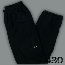 Load image into Gallery viewer, vintage Nike trackpants {M}
