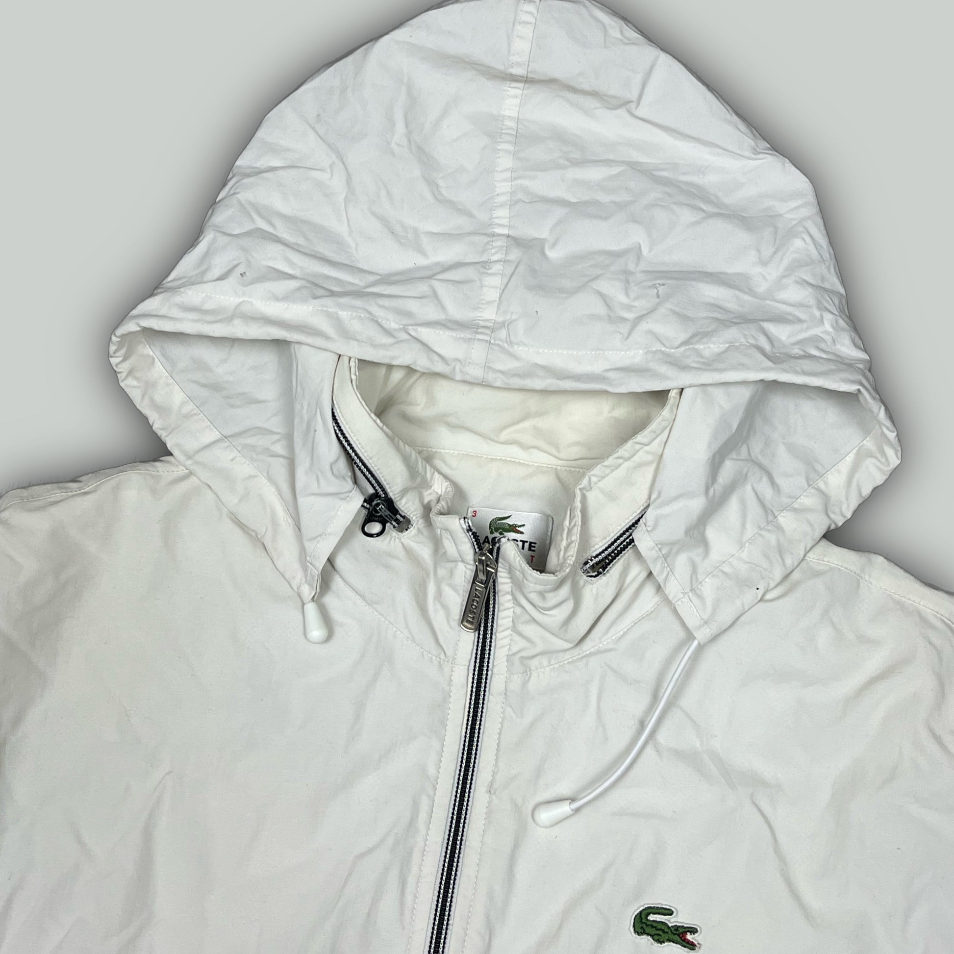 white Lacoste windbreaker {L}