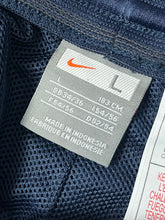 Load image into Gallery viewer, vintage Nike trackpants {L}
