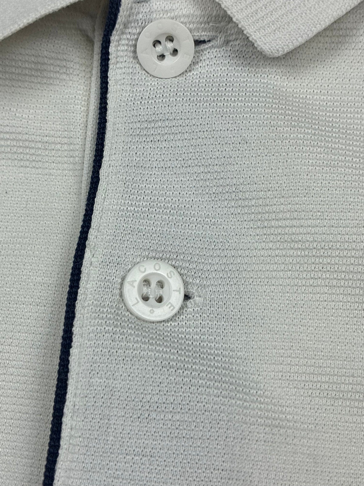 white Lacoste polo {M}
