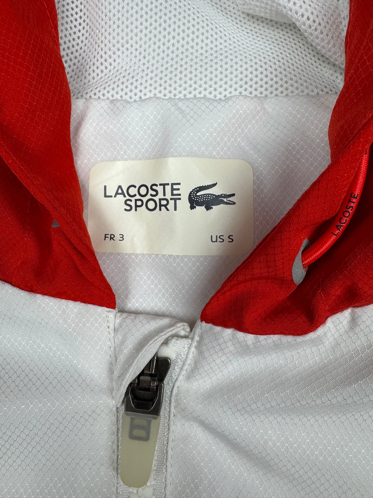 white Lacoste windbreaker {S}