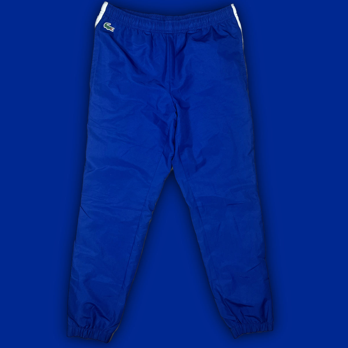 blue Lacoste trackpants {S}