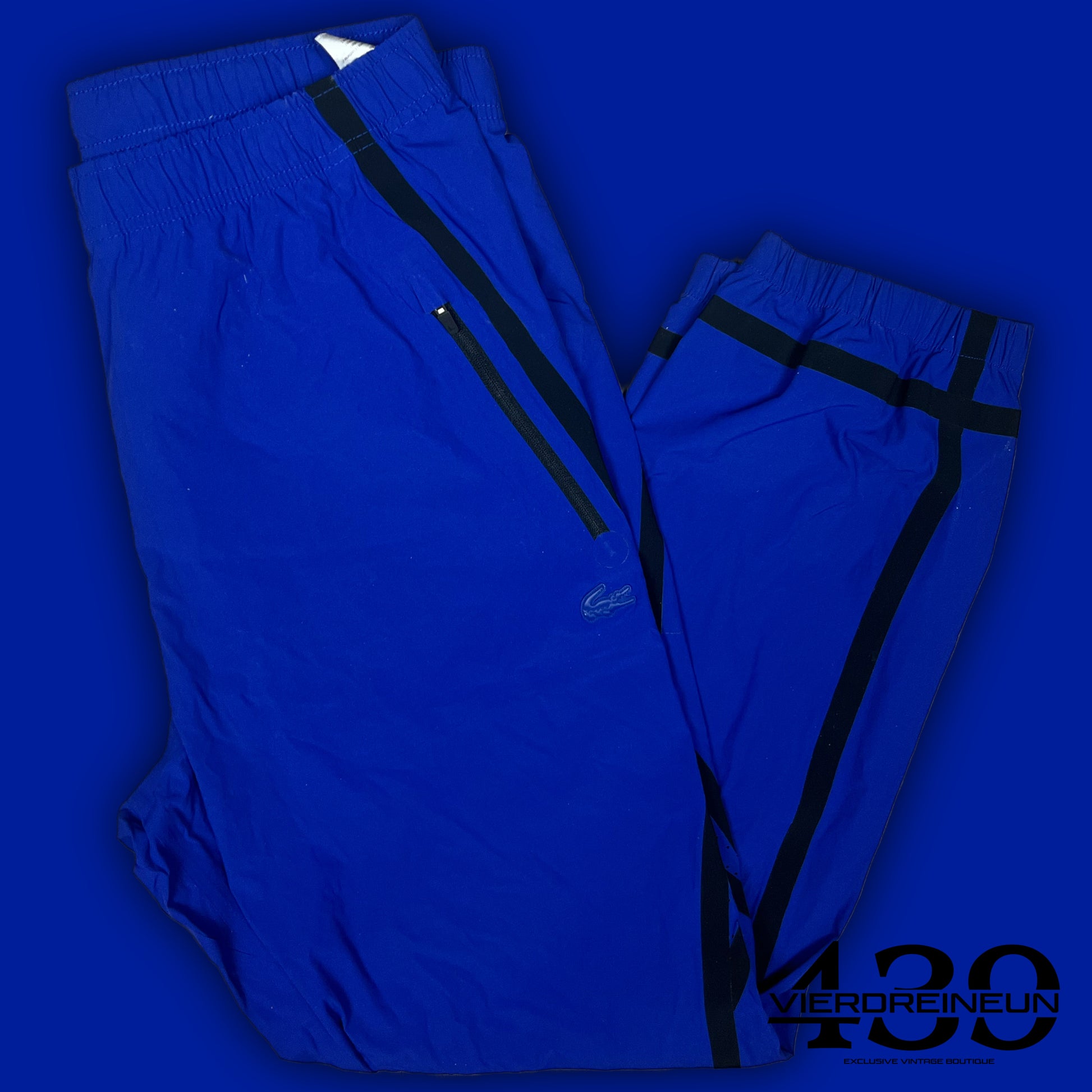 blue Lacoste trackpants {M}