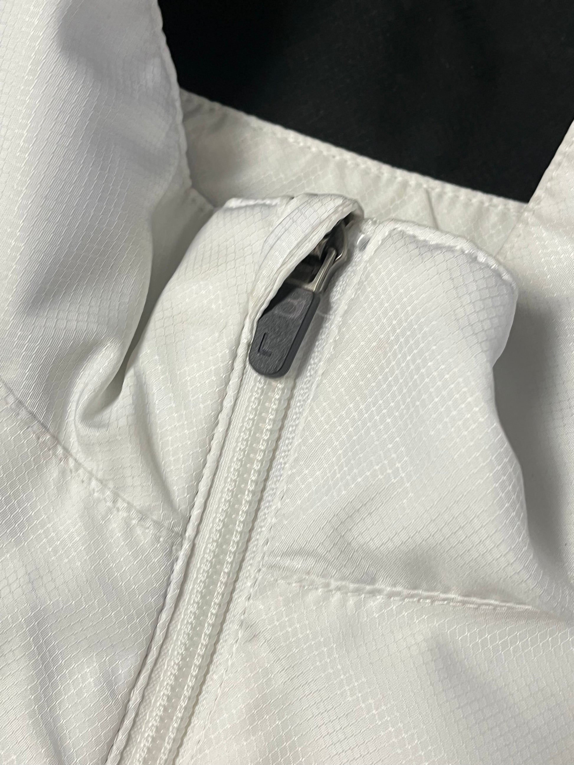 white Lacoste windbreaker {S}